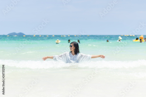 Young women traveling relax on the beach on summer, Concept beach on summer