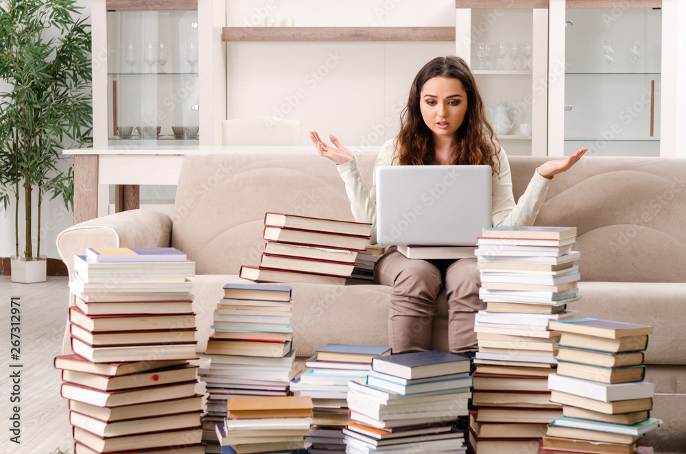 Young female student preparing for exams at home Young female student preparing for exams at home