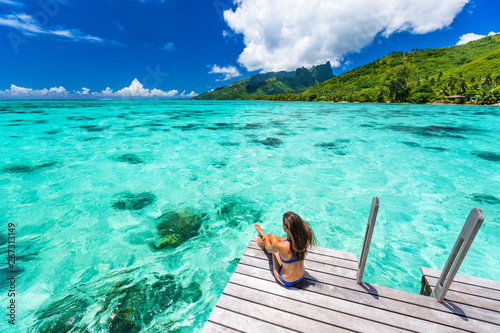 Fototapeta Bora bora luxury travel overwater bungalow resort vacation bikini woman at Tahiti hotel
