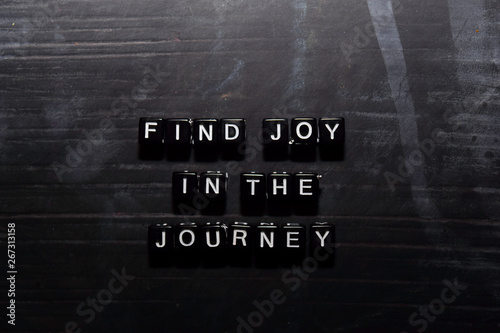 Find joy in the journey on wooden blocks. Education, Motivation and inspiration concept photo
