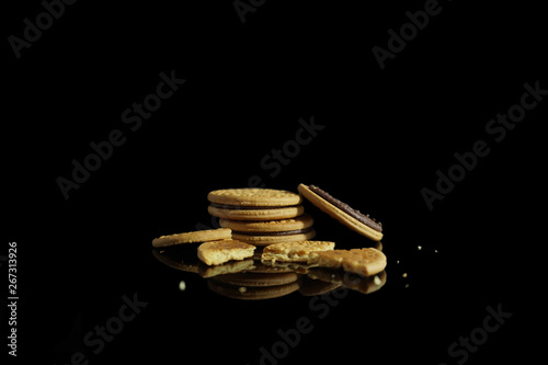 Biscuits crumbles isolated on black background