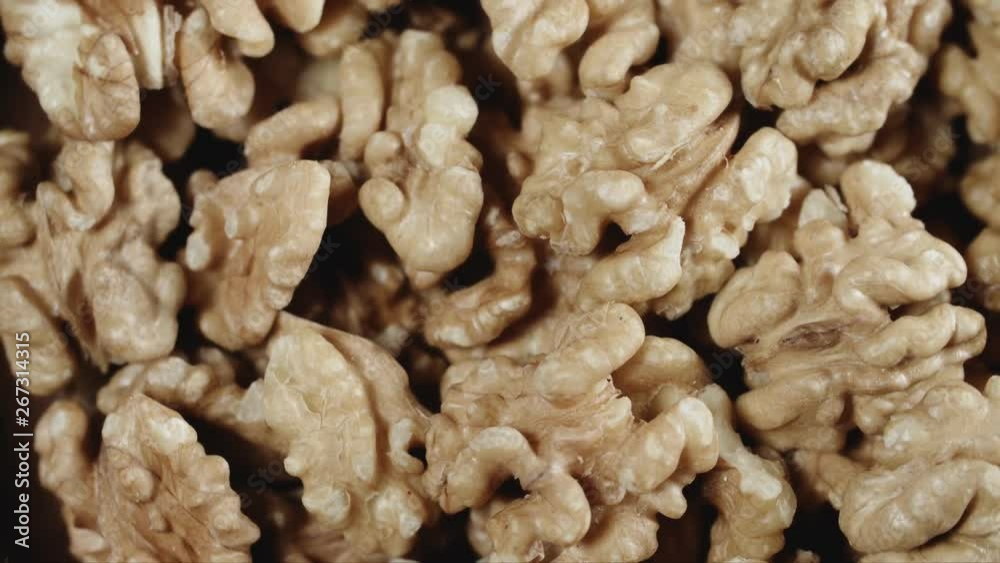 Dry walnut background, close up nut, rotation top view. Food background Dry walnut background, close up nut, rotation top view. Food background