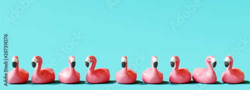Flamingo rubber on pastel blue background. Summer concept. 3d rendering