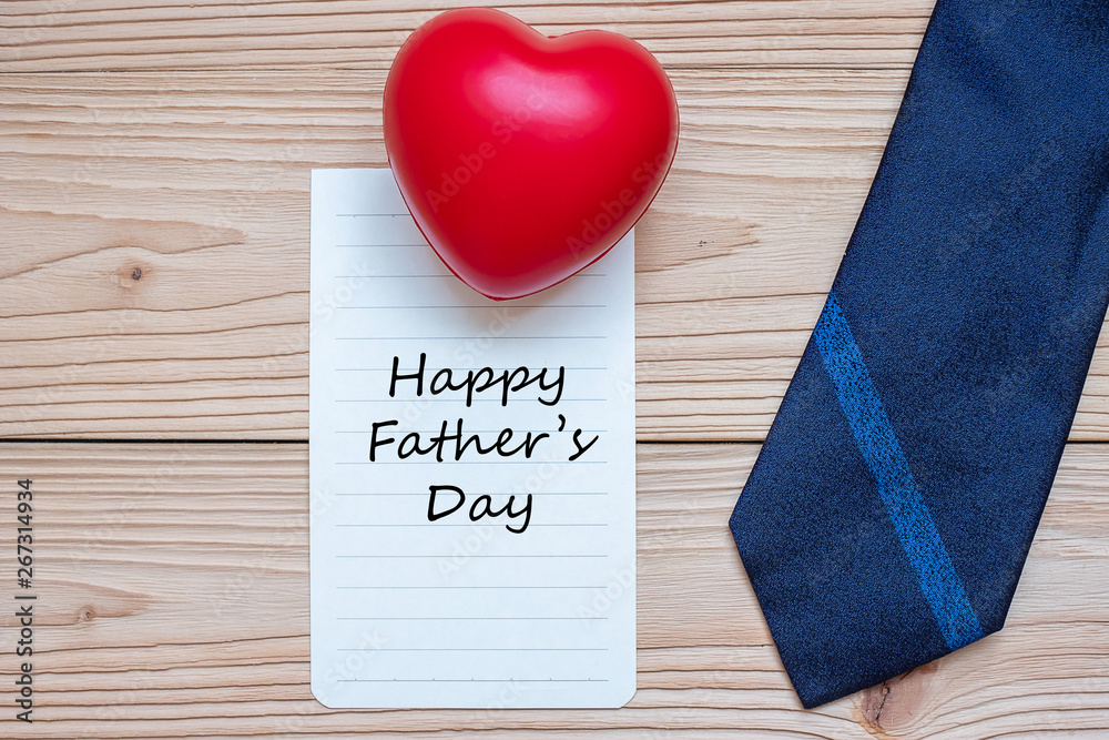 Happy Father's Day with blue neckties and red heart shape on wooden background. International Men's Day concepts Happy Father's Day with blue neckties and red heart shape on wooden background. International Men's Day concepts