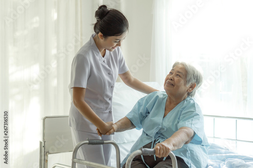 the nurses are well good taken care of elderly patients in hospital bed patients  feel happyness - medical and healthcare concept