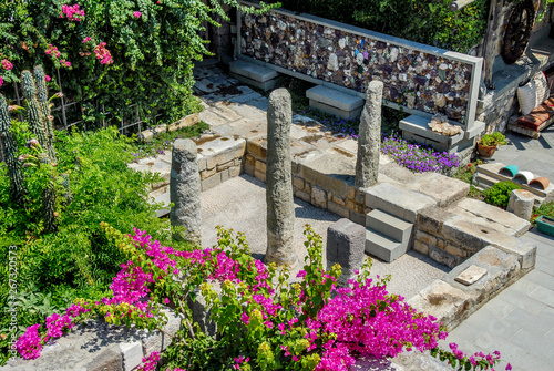 Fototapeta Naklejka Na Ścianę i Meble -  Mugla, Turkey, 25 July 2012: Authentic Stone Bodrum Mansion, Halicarnassus. King of Karia mausolos columns.