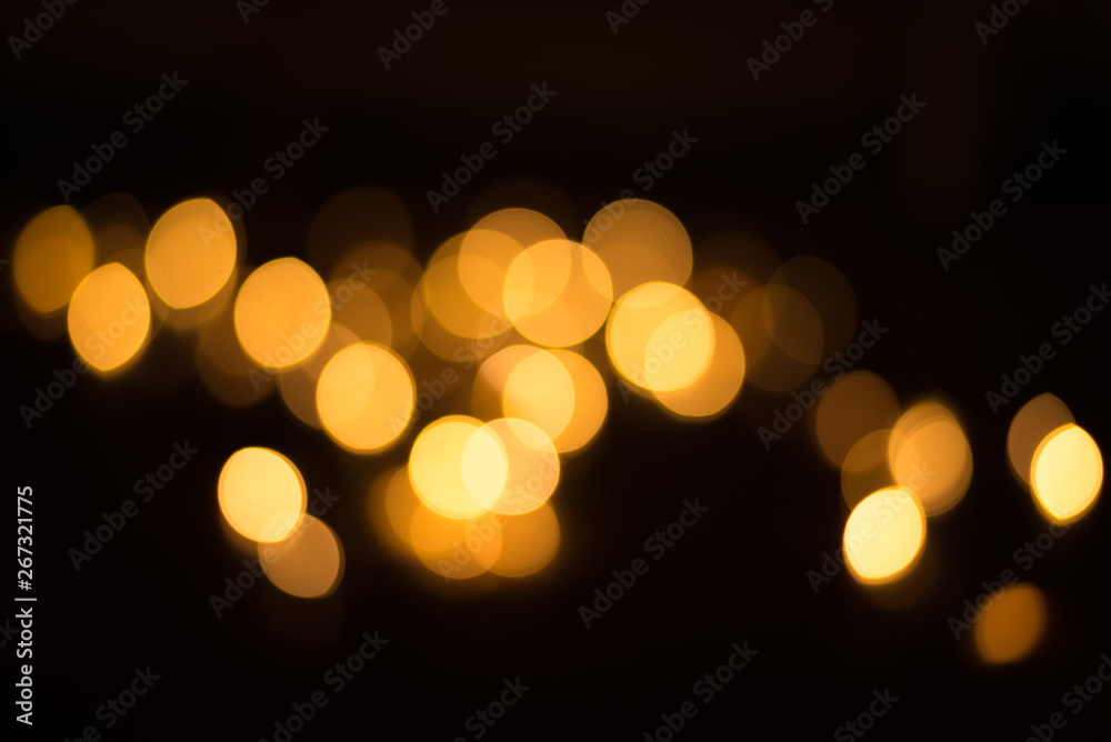 abstract gold bokeh light effect with dark background - obrazy, fototapety, plakaty 
