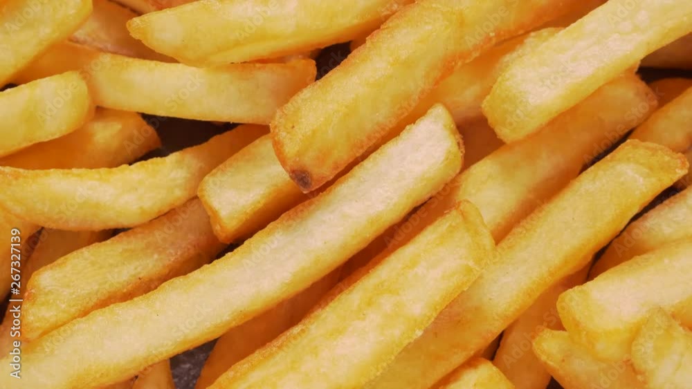 Delicious french fries extreme close up - camera slide, top down view Delicious french fries extreme close up - camera slide, top down view
