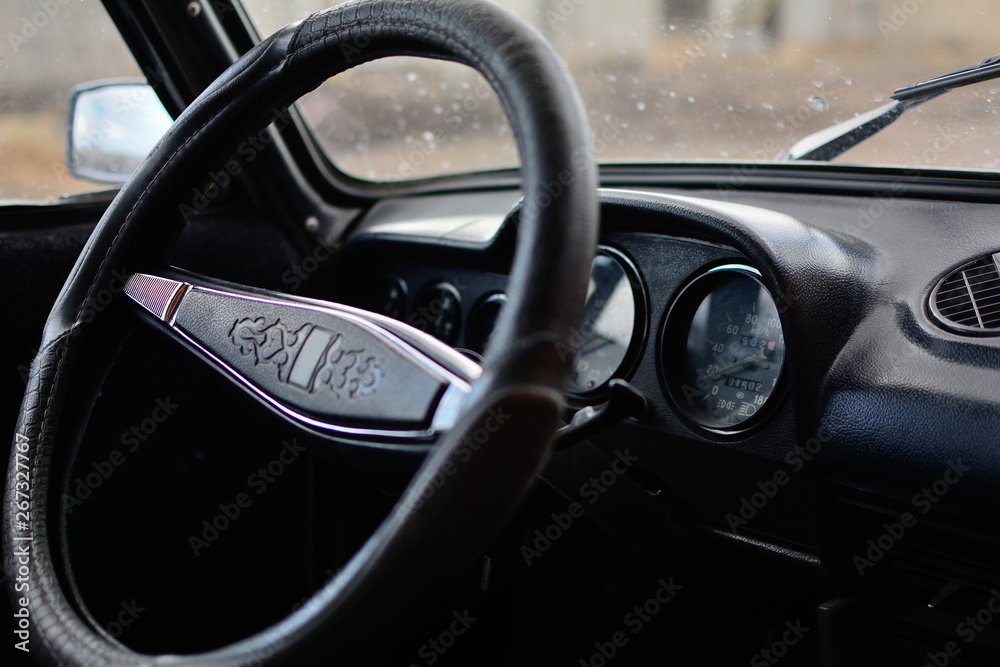 Black control panel in a Russian car with a steering wheel