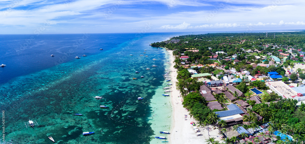 Panorama Aerial drone picture of the white sand Alona Beach in Panglao, Bohol, Philippines