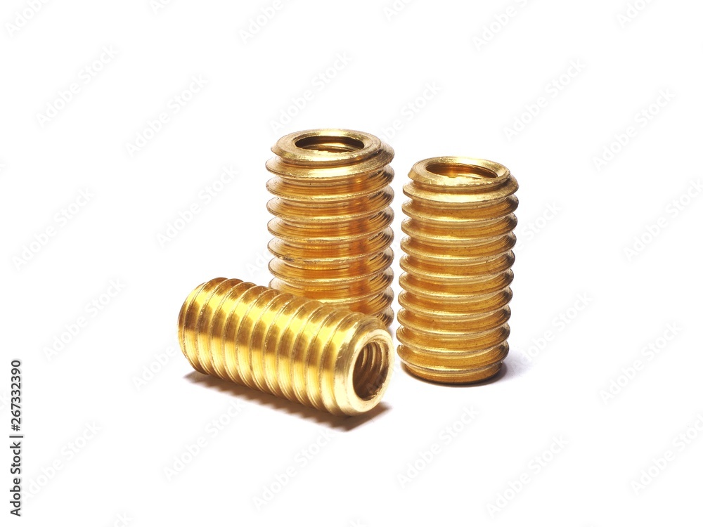 Screw made of brass for repairing damaged screw holes. On a white background. Screw made of brass for repairing damaged screw holes. On a white background.