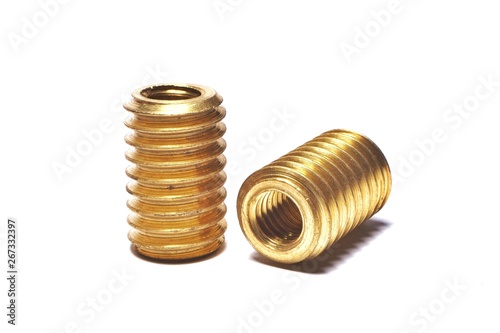 Screw made of brass for repairing damaged screw holes. On a white background.