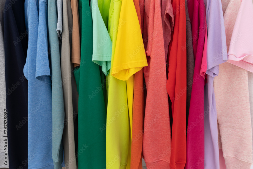 Rainbow colors clothes on hangers for background