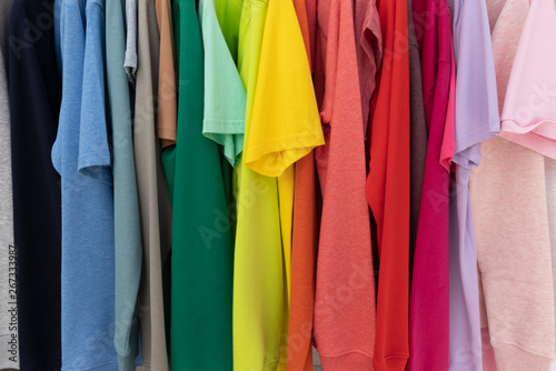Rainbow colors clothes on hangers for background