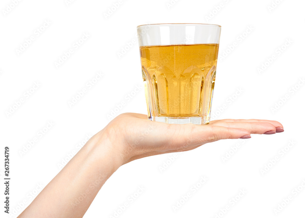 Hand with fresh apple juice in a glass, healthy beverage. Hand with fresh apple juice in a glass, healthy beverage.