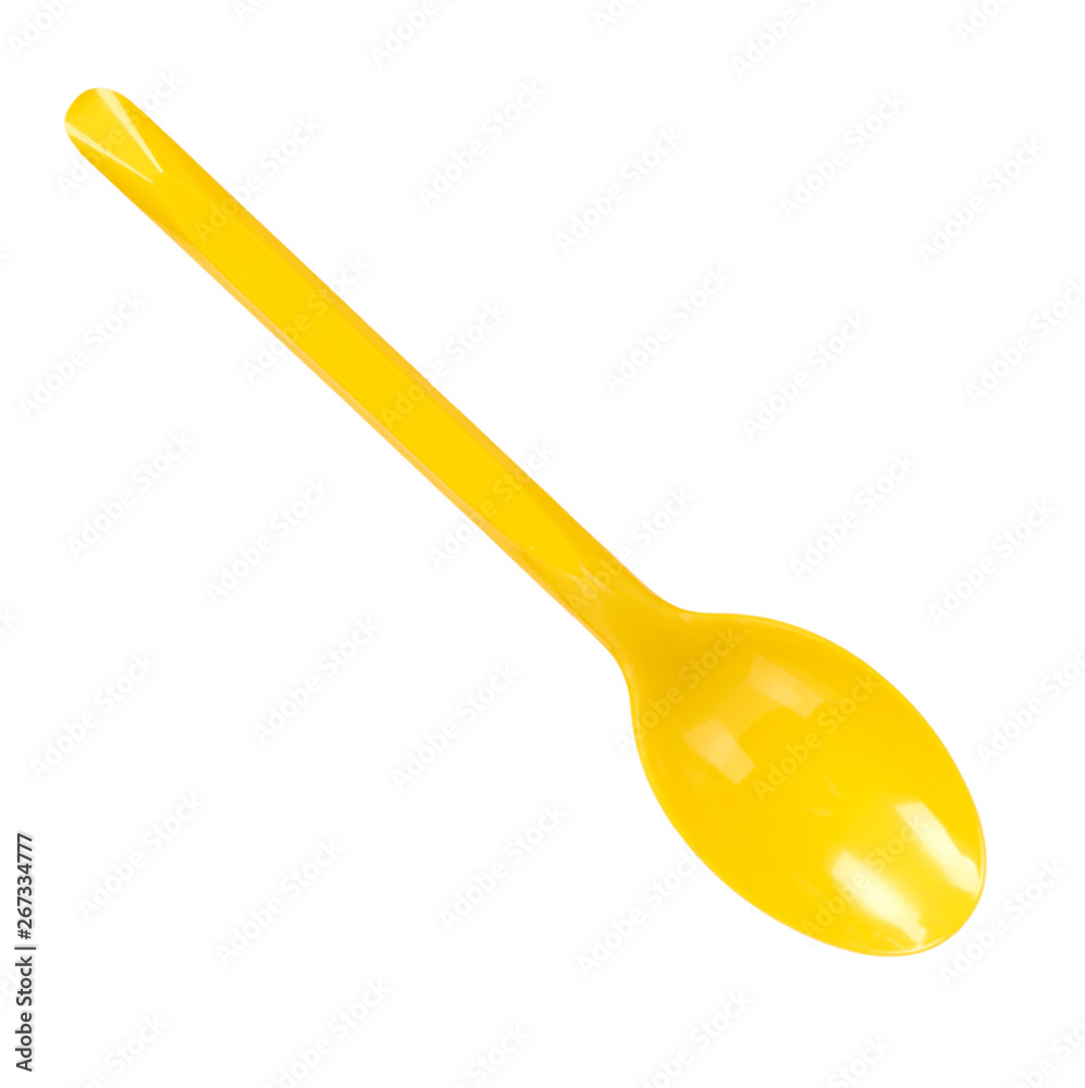 Yellow plastic spoon, disposable utensil. Isolated on white Yellow plastic spoon, disposable utensil. Isolated on white