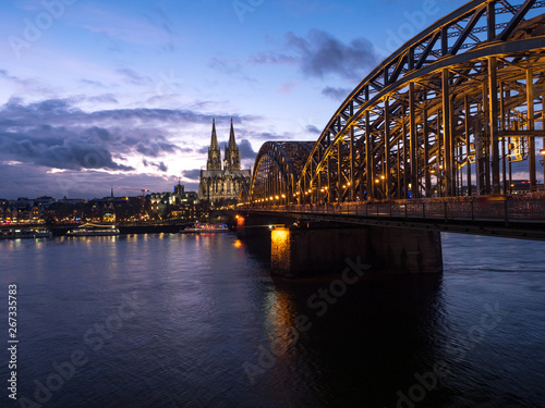 December, 2018: Night view of Hohenzollern Bridge and the cathedral in Cologne, Germany