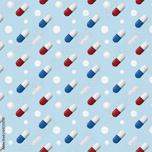 Pattern of different pills and capsules isolated on blue  background
