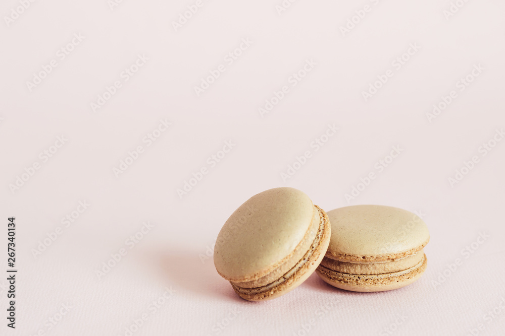 Obraz premium French macaroons cookies with coffee flavors. Holidays food concept with copy space
