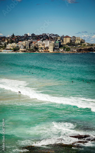 Fototapeta Naklejka Na Ścianę i Meble -  surfers in famous bondi beach sydney australia on sunny day