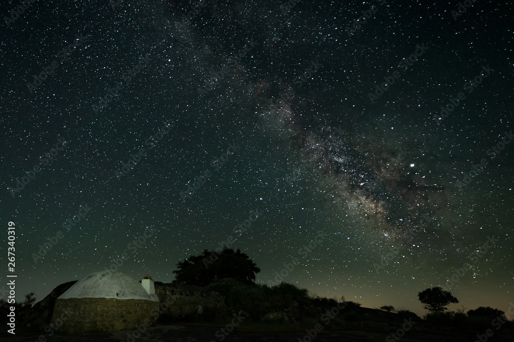 Night landscape with Milky Way in the Natural Park of Barruecos. Extremadura. Spain.