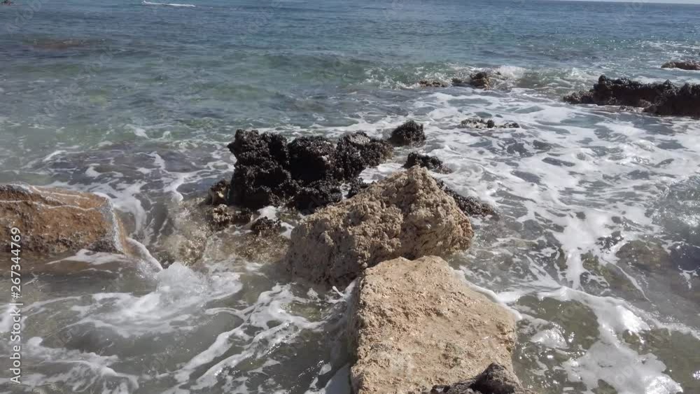 Waves On Rocks Coast of the Mediterranean Sea in Rhodes. Waves On Rocks Coast of the Mediterranean Sea in Rhodes.