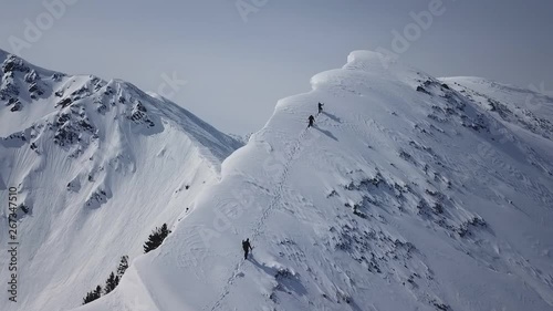 Climbers Walking Up Mountain Expedition Aerial Flight Epic Mountain Range Climb To Success Beautiful Peak Winter Vacation Exploration Adventure Hiking Tourism Concept. photo