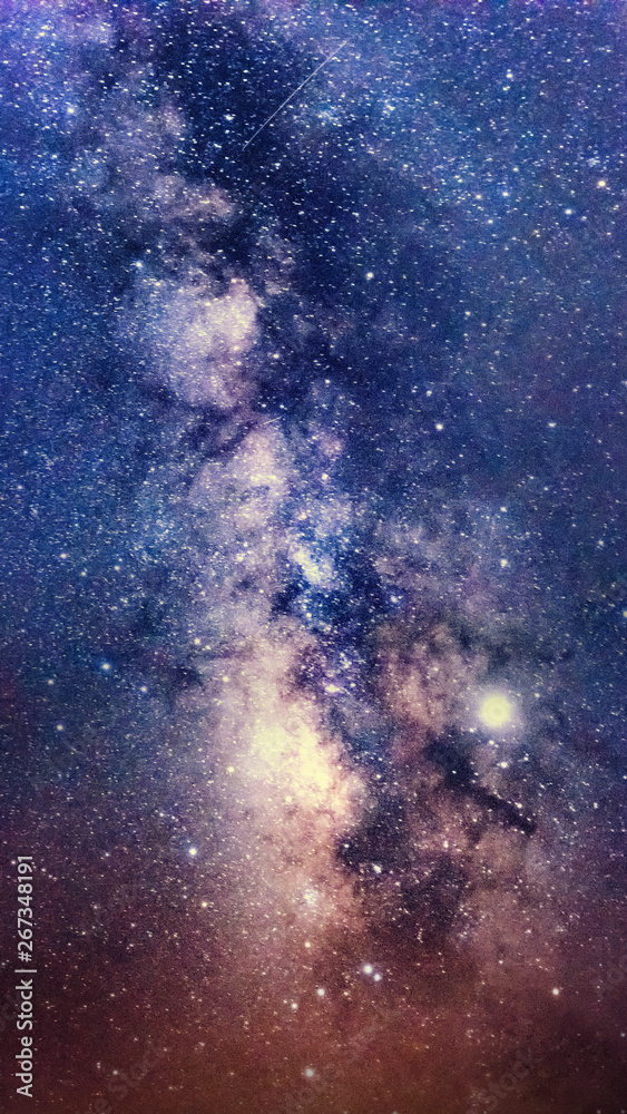 Milky way galaxy with stars and space dust in the universe, Long exposure photograph, Night sky display smartphone background with grain.