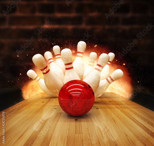 Fotografie Bowling strike hit with fire explosion