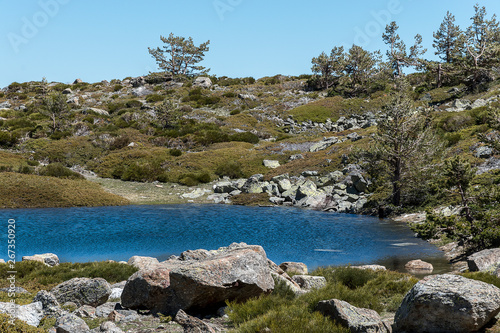 Small glacial lake, of glacial origin, high mountain in spring. Natural Park of the Sierra de Guadarrama, Madrid, Spain © MariaTeresa