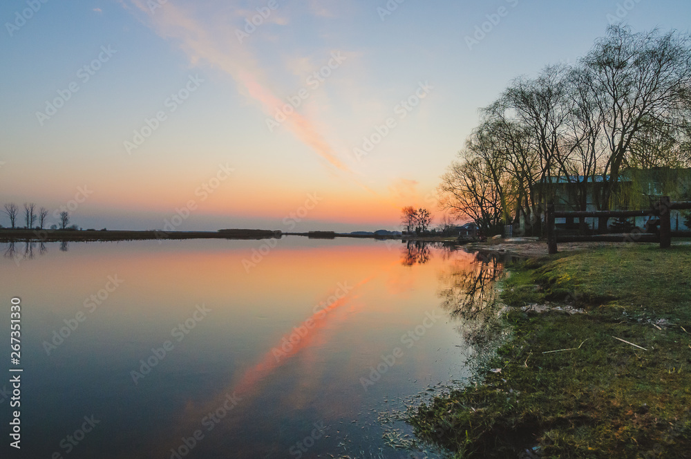 Biebrza Valley (Poland). Sunset over the meadows.