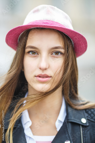 close up portrait of beautiful stylish kid girl in hat