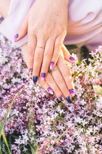 a hand bouquet of flowers and a dress in purple color