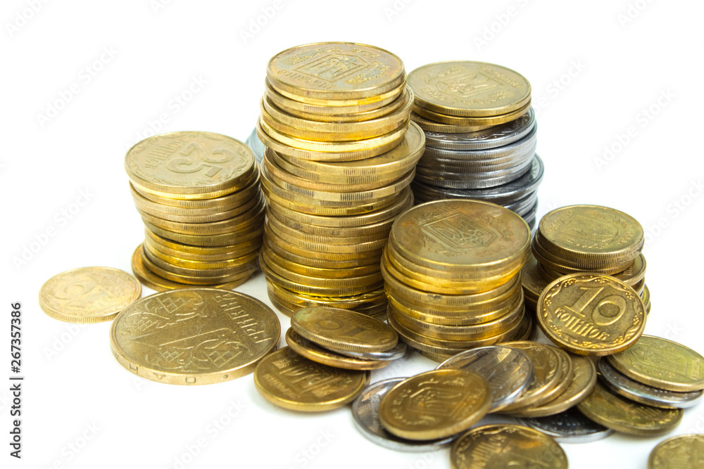 Gold towers made out of gold and silvery of Ukraine coins, stack isolated on white. Gold towers made out of gold and silvery of Ukraine coins, stack isolated on white.