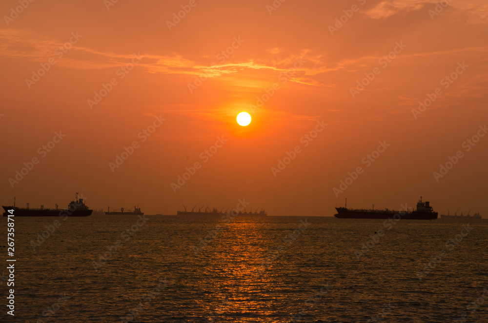  sunset sky or dawn shines in pink, natural pink and sea boats in the sea or lake. Warm color background