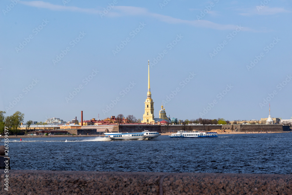 pleasure boats on the Neva river in the spring against the Peter and Paul fortress