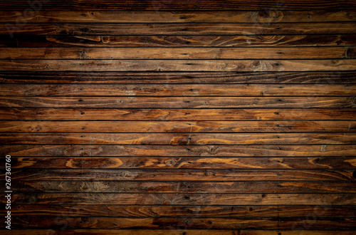 Wooden floor closeup view. Vintage brown wood wall texture with vignette
