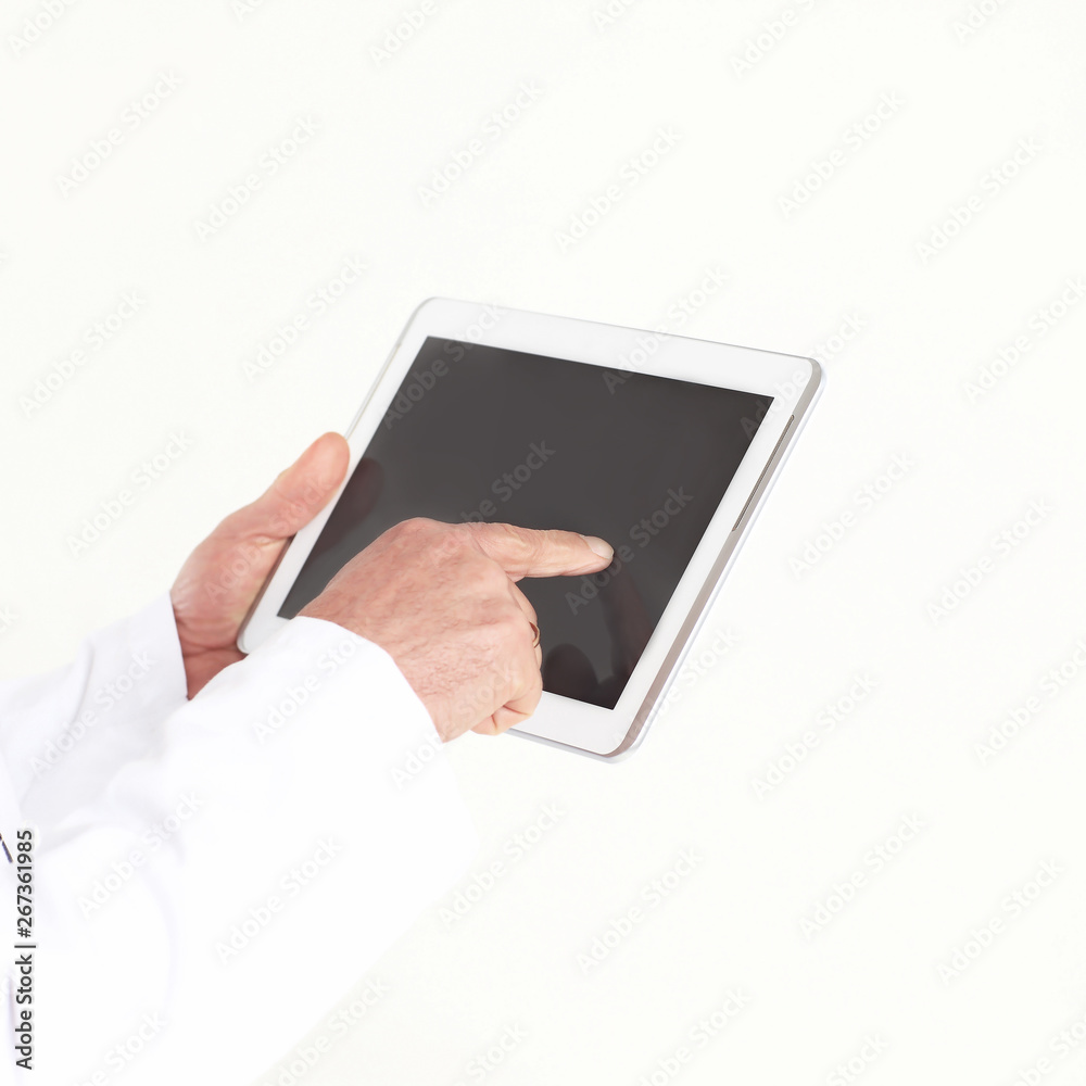 close up.doctor tapping the screen of the digital tablet .isolated on white background close up.doctor tapping the screen of the digital tablet .isolated on white background