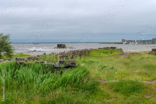 Old foundation of the destroyed building on the stone coast of the White Sea in the vicinity of the village Rabocheostrovsk, Popov Island, Kemsky District, Republic of Karelia, Russia © Konstantin