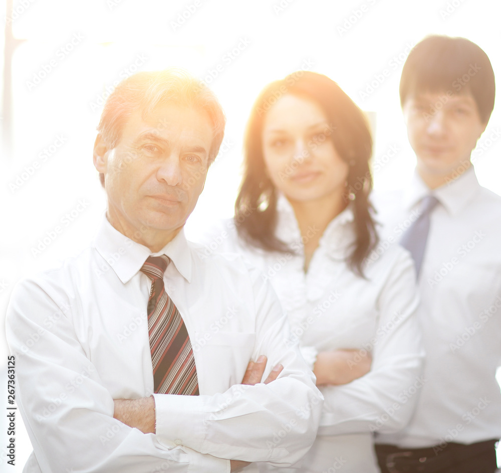 confident business team in the background of the office confident business team in the background of the office