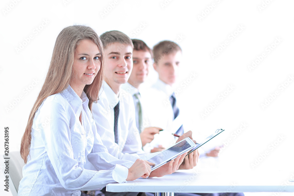 side view.young business team sitting at the Desk side view.young business team sitting at the Desk
