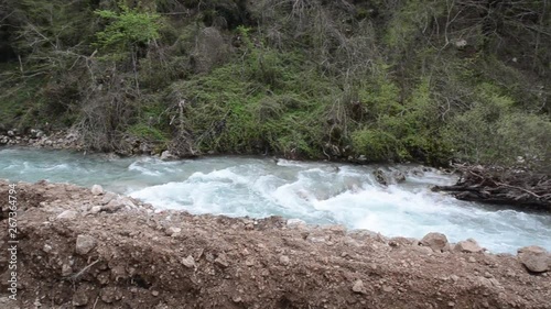 Building mini hydropower are resulting with extensive damage to the local ecosystems. Destroyed river bank and landscape. Save the river. Ecology disaster. Micro hydro power plant photo