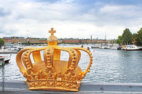 Golden crown detail on bridge in Stockholm, Sweden