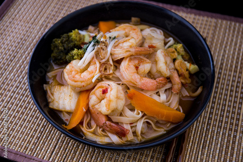 Tom Yam kung Spicy Thai soup in bowl