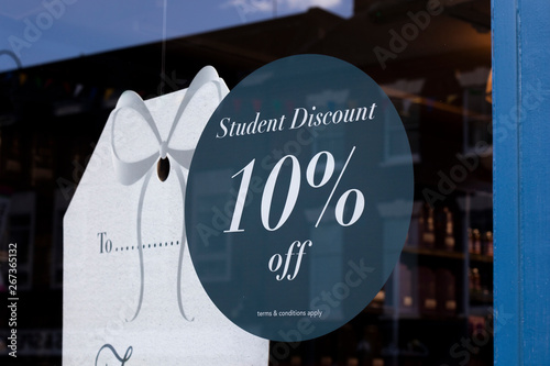 ten percent student discount sign in high street clothing shop window