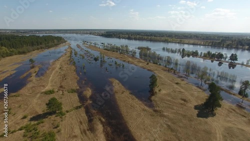 Flying over Field in Spring during Spill.	Top view of the field during the spring flood. On the water field, next to the river field