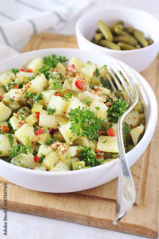 Potato salad with pickled cucumbers and parsley, mustard sauce Potato salad with pickled cucumbers and parsley, mustard sauce