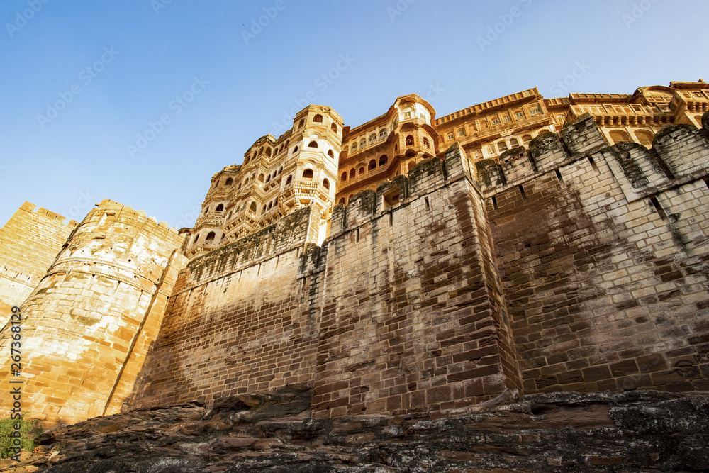 Stunning view of the ancient Mehrangarh Fort during a beautiful sunset. Jodhpur, Rajasthan, India. Mehrangarh (Mehran Fort) is one of the largest forts in India.