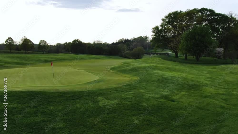 Golf course in Lancaster, PA. Pan revealing red flag on green. Pennsylvania countryside 4k Golf course in Lancaster, PA. Pan revealing red flag on green. Pennsylvania countryside 4k