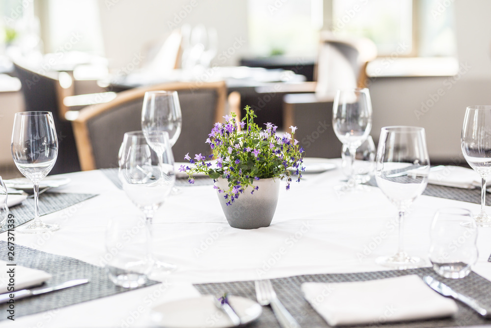 Luxury table with glasses, napkins and cutlery in restaurant or hotel Luxury table with glasses, napkins and cutlery in restaurant or hotel